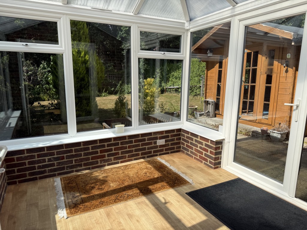 Lot: 122 - DETACHED BUNGALOW WITH ROOF CONVERSION AND POTENTIAL - Ground floor conservatory leading to rear garden